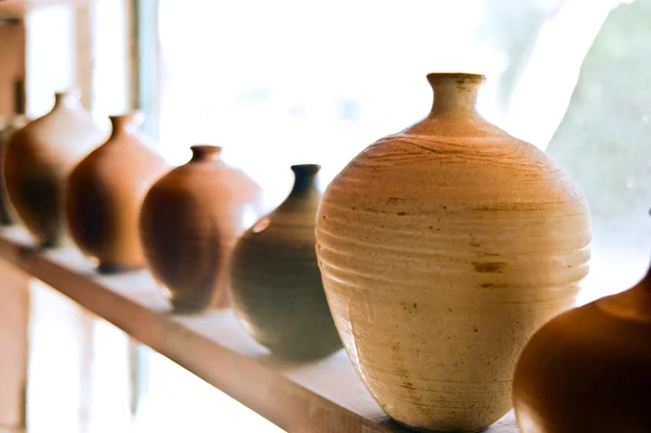 stock image Pottery vases on shelf