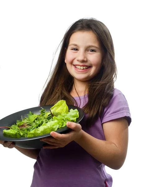 stock image Young girl holding plate with salad