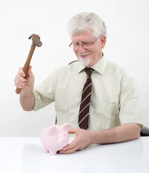 Senior man and piggybank — Stock Photo, Image