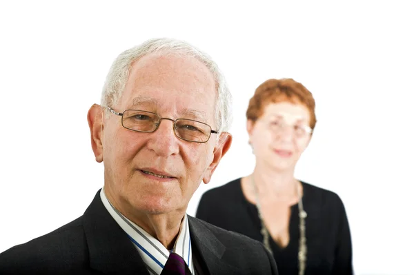 Senior businessman and with colleague in the bac — Stock Photo, Image