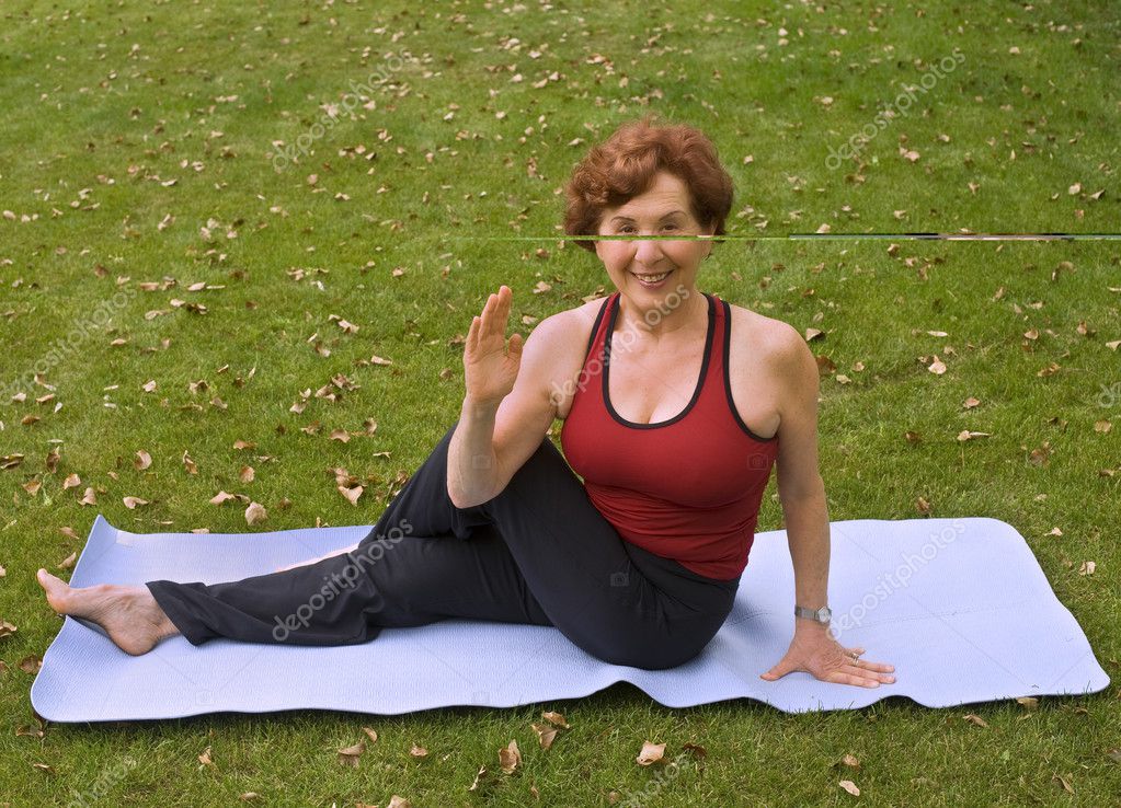 Senior woman yoga Stock Photo by ©NoamArmonn 2223804