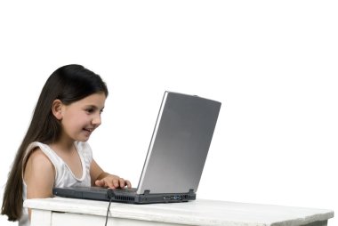 Littel girl with laptop computer clipart