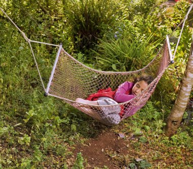 Girl sleeping in a hammock clipart