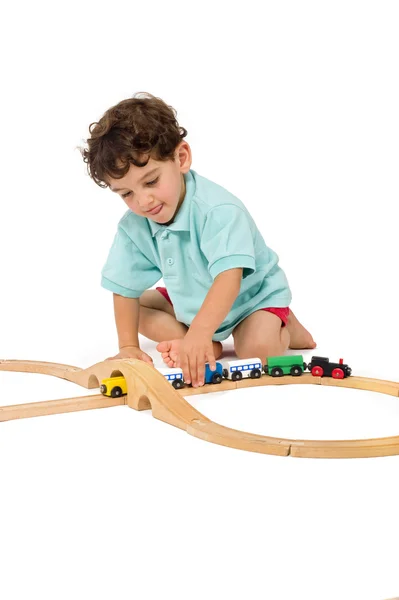 Menino brincando com trem — Fotografia de Stock
