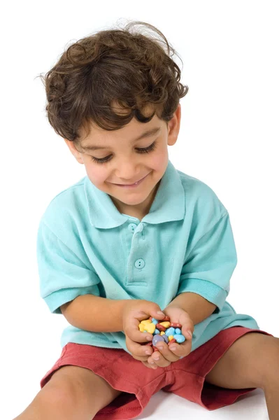 Caramelos en manos de niños —  Fotos de Stock