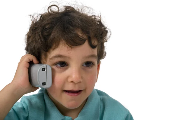Ung pojke pratar i telefon — Stockfoto