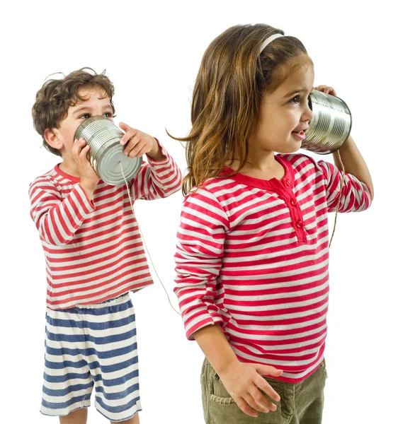 Dwójka dzieci rozmawiająca przez cynowy telefon — Zdjęcie stockowe
