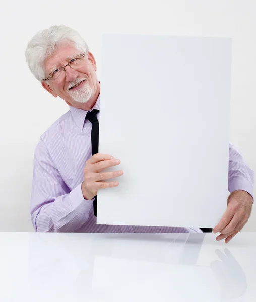Senior businessman and sign — Stock Photo, Image