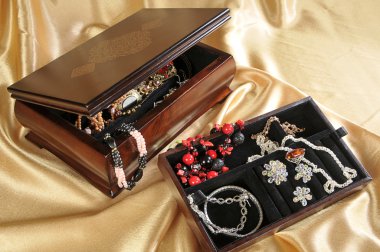 Wooden box with jewelry clipart