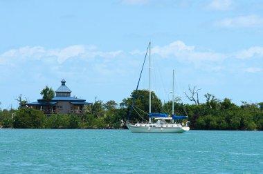 Yacht in carribean sea clipart