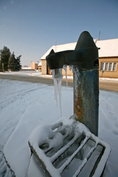 Frozen old water pump in Czech village — Stock Photo, Image