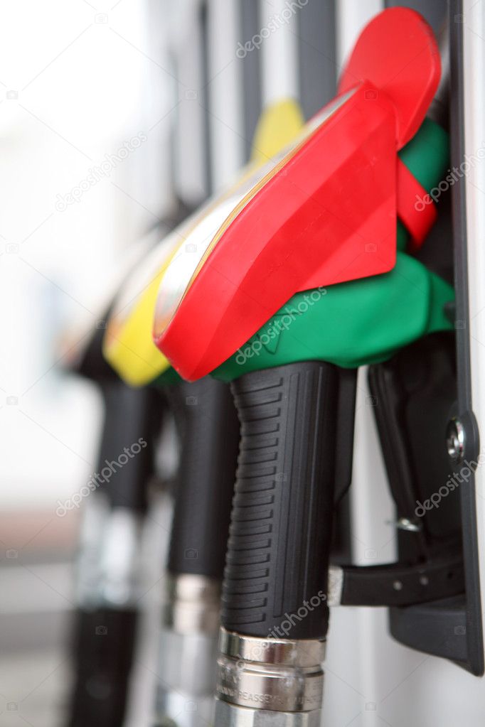 Gasoline pump nozzles at petrol station