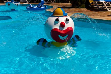 Fountain in children pool clipart