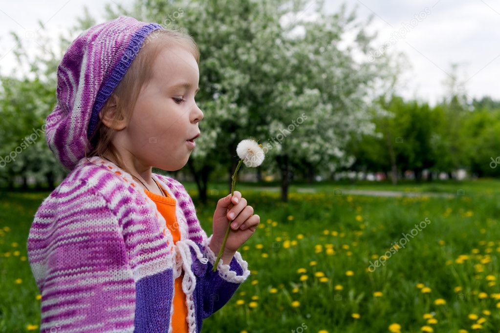 The girl and a dandelion