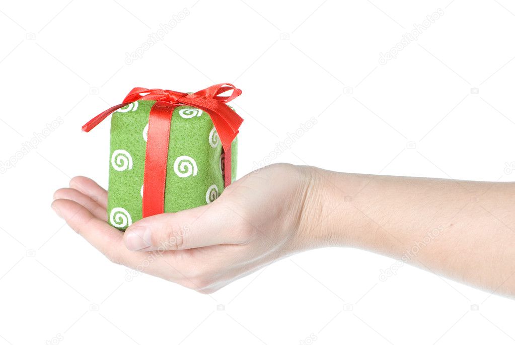 Hand holding gift isolated on white