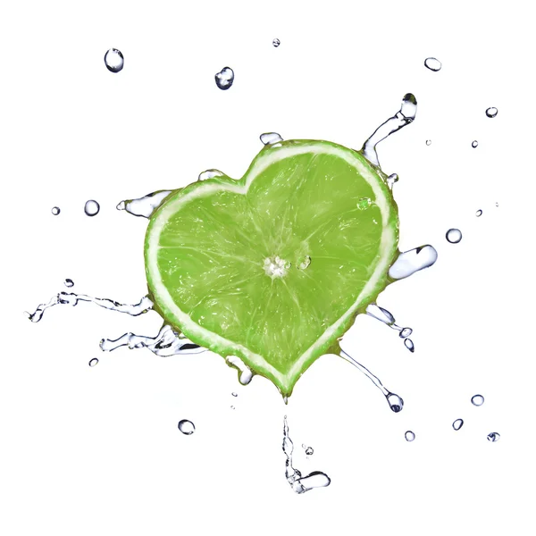 Heart from lime dropped into water — Stock Photo, Image