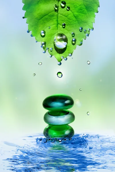 Wellness stones in water splash — Stockfoto