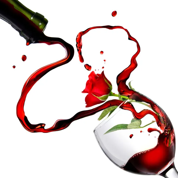 Heart from pouring red wine in goblet — Stock Photo, Image