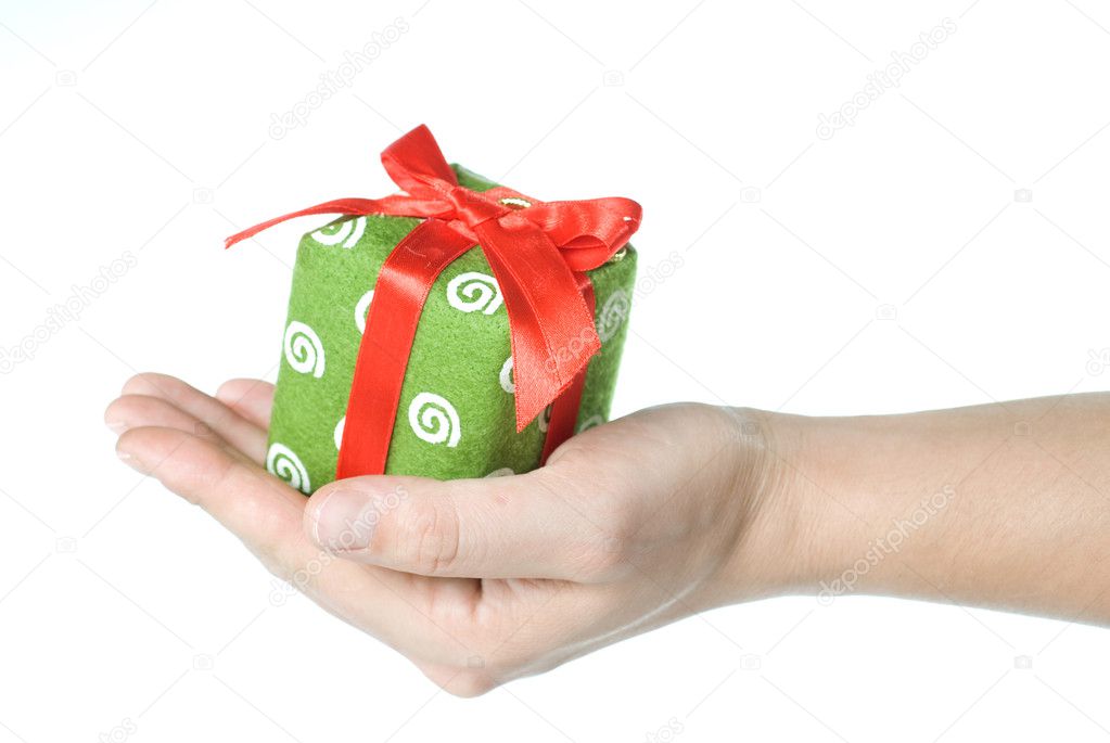 Hand holding gift isolated on white