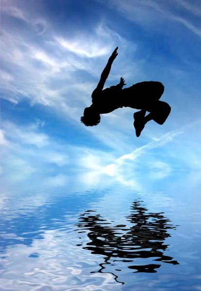 Silhouette of jumping man — Stock Photo, Image