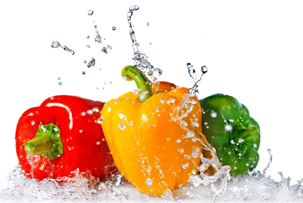 Peper en peterselie met water splash — Stockfoto