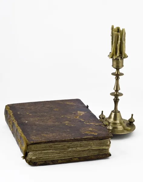 Candlestick and a book — Stock Photo, Image