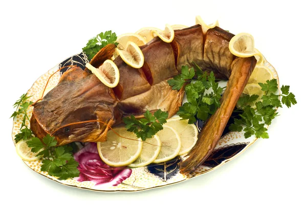 Bloated sheatfish with lemon and parsley — Stock Photo, Image
