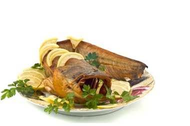 Shore dinner - bloated catfish (sheatfish) with clipart