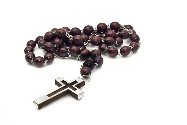 Wooden beads with metallic cross — Stock Photo, Image