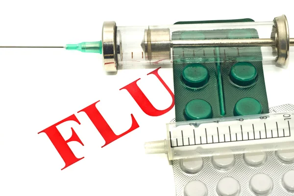 Swine FLU H1N1 - таблетки и шприц — стоковое фото