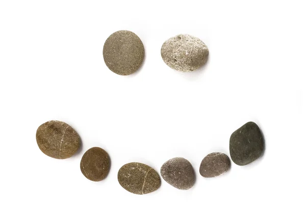 Funny emoticon assembled of pebble — Stock Photo, Image