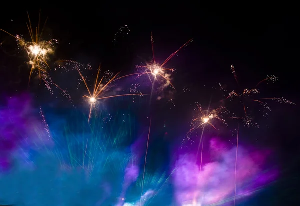 Fireworks in the lilac and blue smoke — Stock Photo, Image