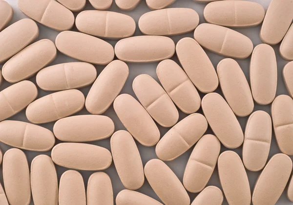 Close-up de pílulas rosa — Fotografia de Stock