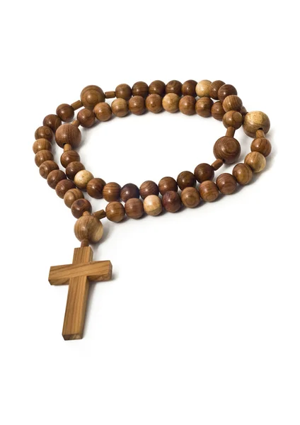 Beads isolated over white with focus on christ — Stock Photo, Image
