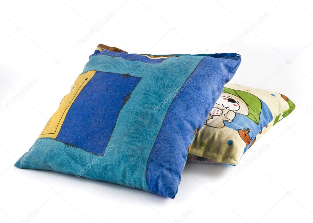 Two colorful pillows over white