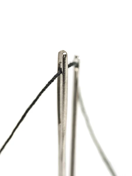 Needles with black thread — Zdjęcie stockowe