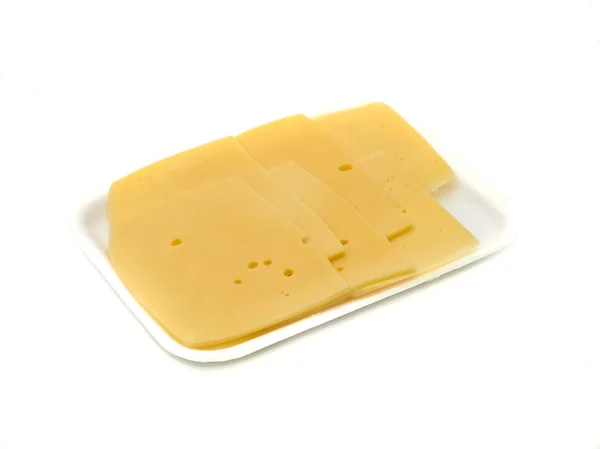 Sabroso queso en rodajas en el envasado al vacío —  Fotos de Stock