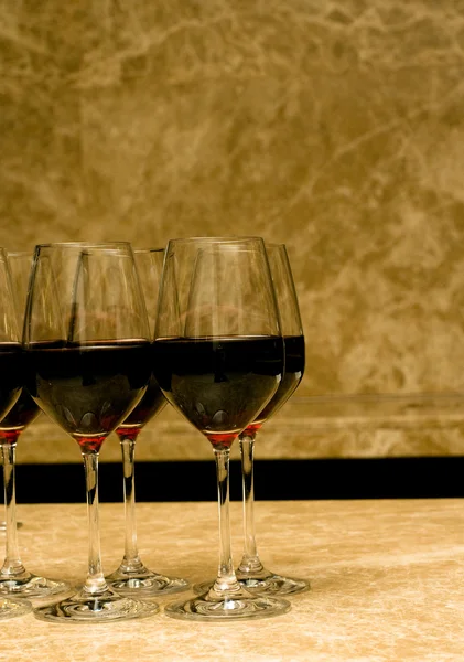 Glasses with red wine on marble — 스톡 사진