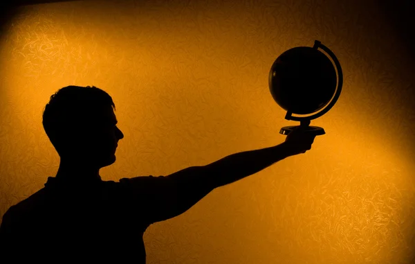 World in your hands - silhouette of man — Stock Photo, Image