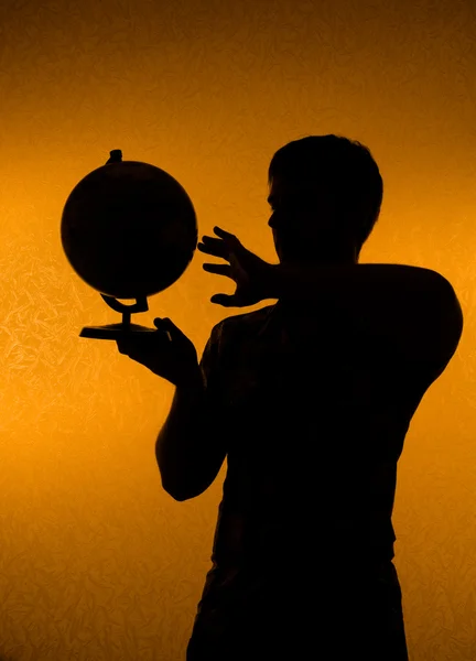 Discover the world - silhouette of man holding g — Stock Photo, Image