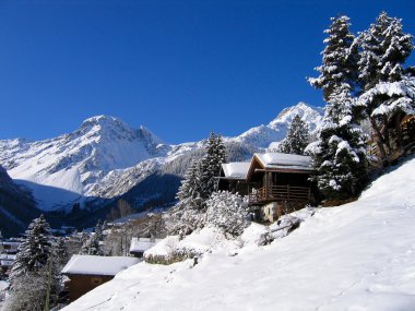 Chalets in a snow white valley