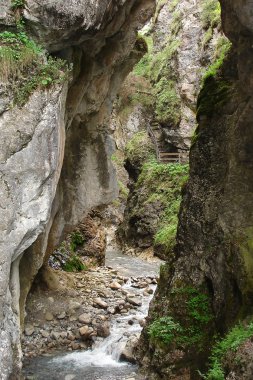 Narrow canyon in the Alps clipart