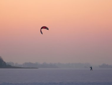 Kite skating at sunset clipart