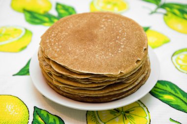 Hill from pancakes on white plate