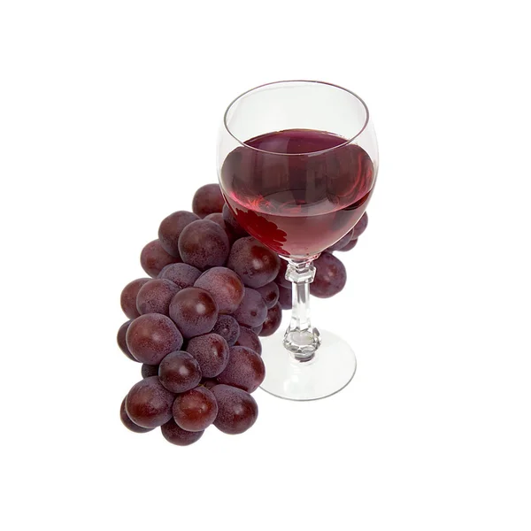 Uvas vermelhas e vidro com vinho — Fotografia de Stock