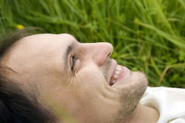 The man lies on a grass — Stock Photo, Image
