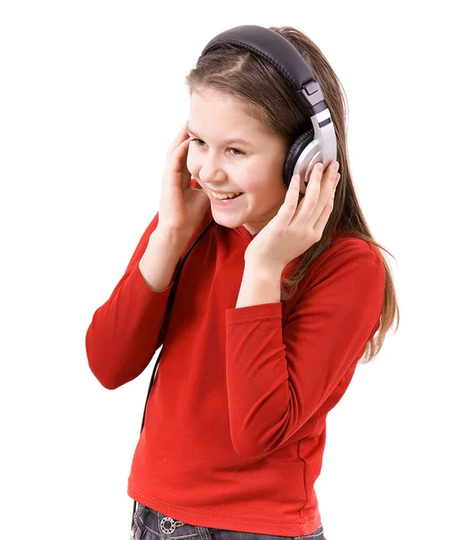 Barnet lyssnar på musik — Stockfoto