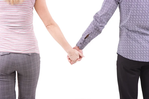 Mężczyzna i kobieta trzymać się za ręce — Zdjęcie stockowe