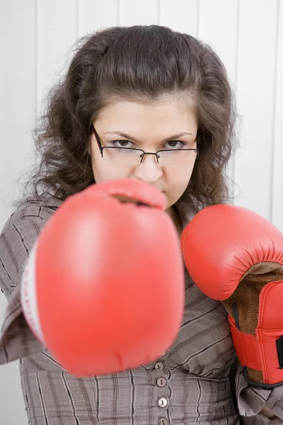 The serious girl in boxing gloves — Stock Photo, Image