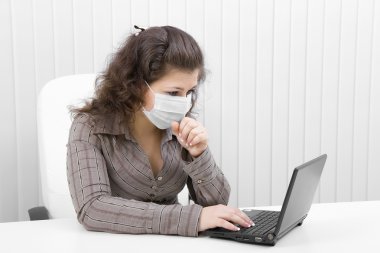 The woman in mask with the laptop clipart